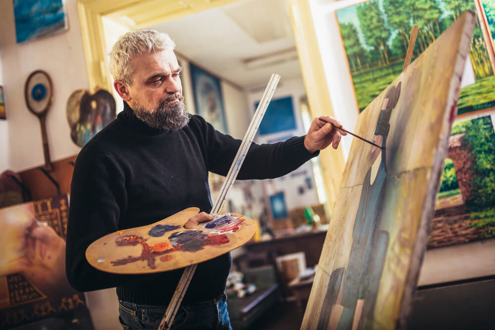 Senior man painting